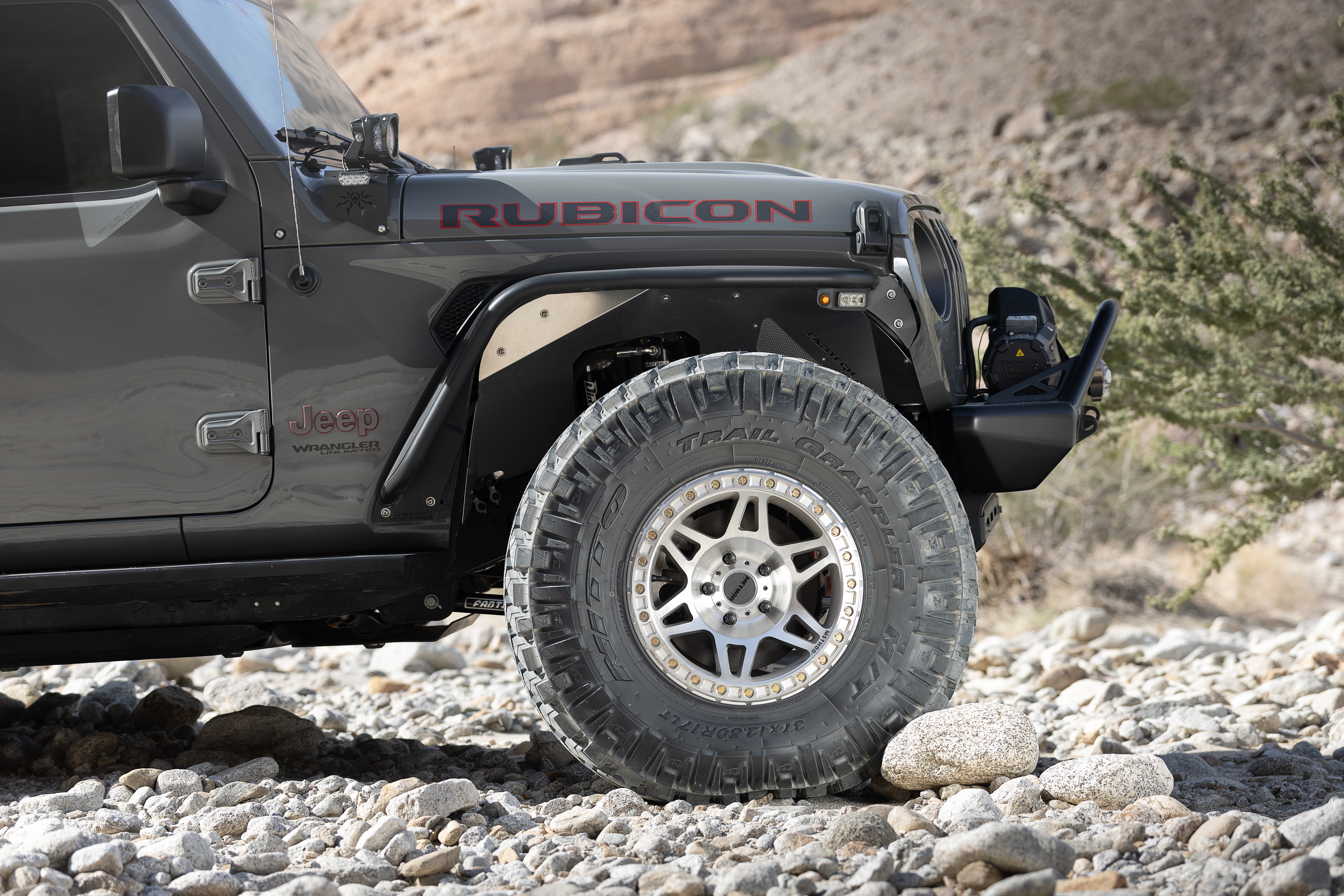 Poison Spyder Nightshade JL Wrangler with Fabtech steel tube fenders and 37-inch tires