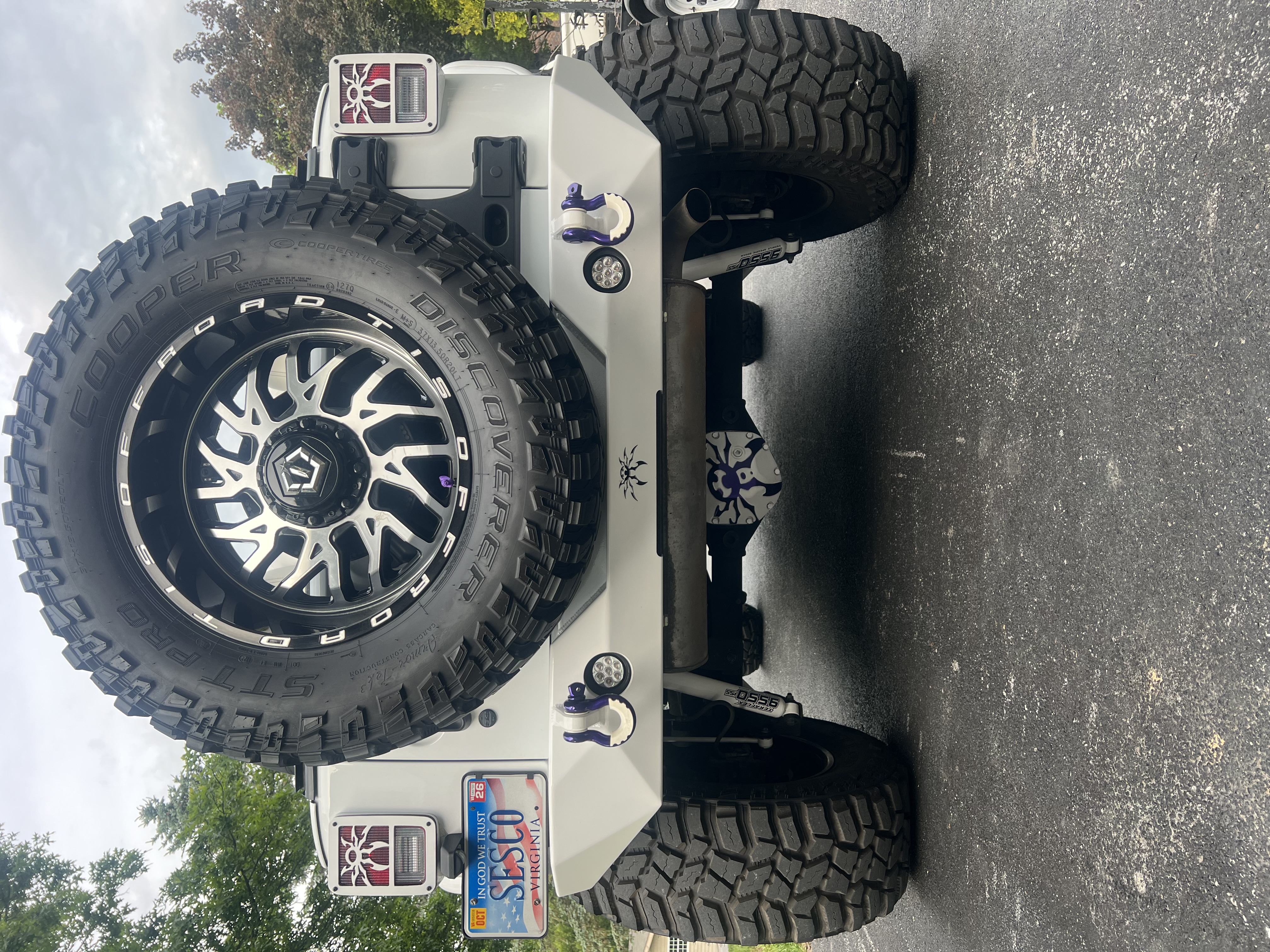 Poison Spyder White Venomous rear suspension and 37-inch Cooper tires on TIS wheels