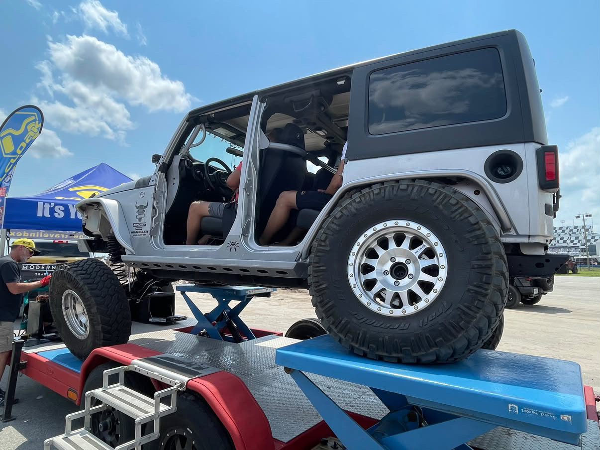 Poison Spyder Platinum Jeep Wrangler interior with roll cage and Corbeau seats