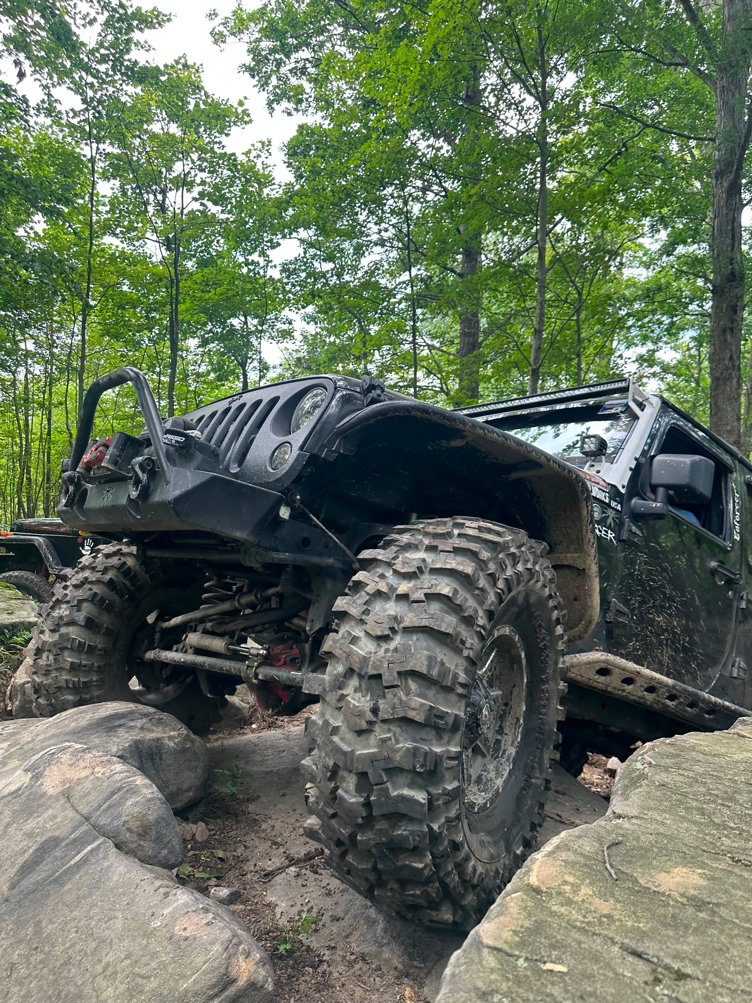 Jeep Wrangler JK front end on the trail showing Rock Krawler suspension and Fox shocks